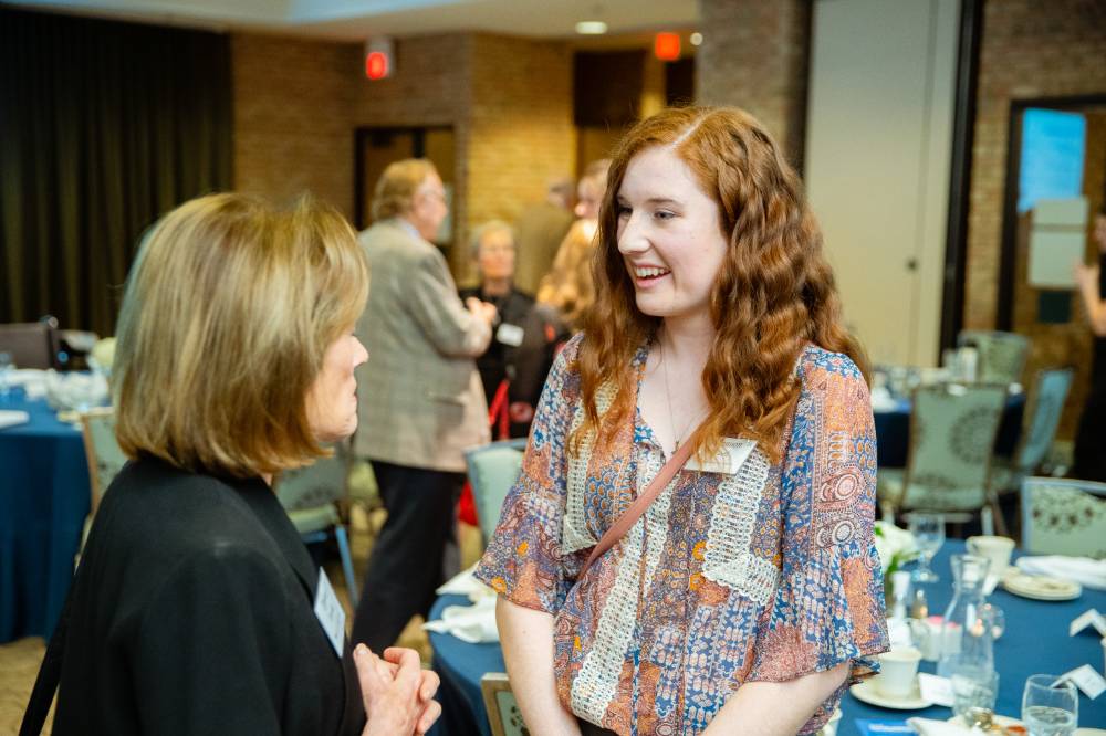 Student speaking to a donor at Scholarship Dinner 2019